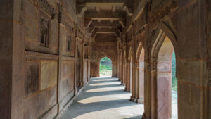 a stone archway with arches and carvings